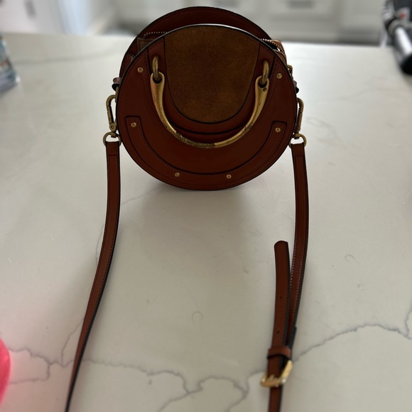 Tan, round, cross body purse - Picture 2 of 5